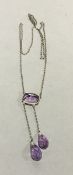 An amethyst pendant necklace