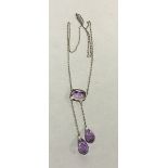 An amethyst pendant necklace