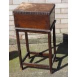 An early 20th century oak sewing box