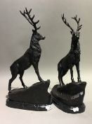 A pair of bronze stags