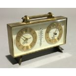 A brass cased clock and barometer