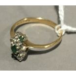 A 9 ct gold emerald and white stone set ring