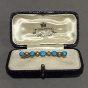 A turquoise and seed pearl bar brooch