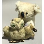 A stuffed toy koala and an owl