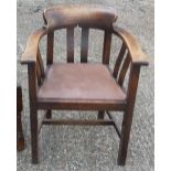 An early 20th century oak desk chair