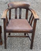 An early 20th century oak desk chair