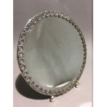 A Continental silver mirror of circular form.
