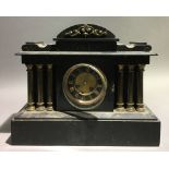 A Victorian black slate mantle clock