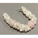 A silver and rose quartz bracelet