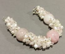 A silver and rose quartz bracelet