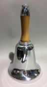 A vintage chrome and wood handled bell shaped cocktail shaker