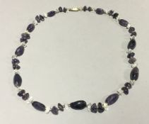 An amethyst and quartz bead necklace