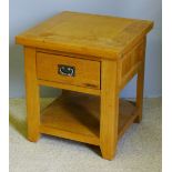 A modern blonde oak side table