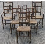 A set of six pre-1950s rush seated spindle-back dining chairs,