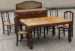 An early 20th century French oak dining set, comprising a dining table, sideboard,