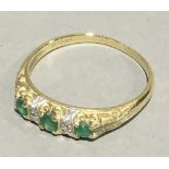 A 9 ct gold diamond and emerald ring