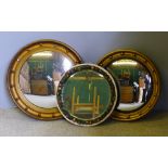 Two gilt framed convex wall glasses and another wall glass