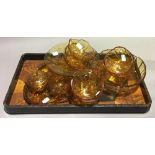 A quantity of amber glass and a Japanese lacquered tray