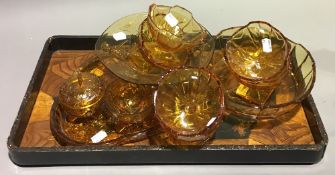 A quantity of amber glass and a Japanese lacquered tray