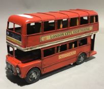 A tin toy London bus