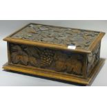 A Victorian florally carved oak box