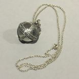 A rock crystal silver mounted pendant orb on chain