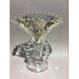 A sterling silver and glass vase with beaded handles,