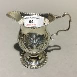 A silver cream jug,