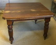 A Victorian walnut dining table