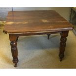 A Victorian walnut dining table