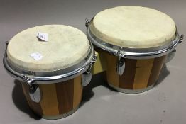 A conga(?) drum and bongo drums
