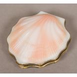 A Russian silver gilt mounted compact Of small clam shell form. 7 cm wide.