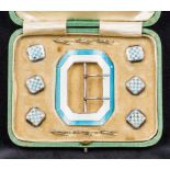 A cased set of Edwardian enamel decorated silver buckle and shirt studs,