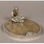 An early 20th century silvered bronze ashtray Modelled with a Native American Indian and opposing