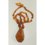 An 'amber' necklace and pendant