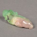 A Chinese carved green and amethyst jade carp 7.5 cm long.