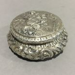 A Continental embossed silver box