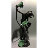 A tall bronze model of a pixie