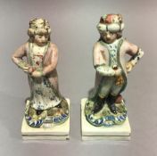 A pair of late 19th/early 20th century Staffordshire figures