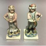A pair of late 19th/early 20th century Staffordshire figures