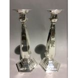 An unusual pair of sterling silver Art Deco candlesticks, American,