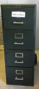 A vintage green painted metal filing cabinet