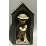 A vintage sentry box teddy bear