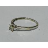 A 9 ct white gold diamond set solitaire ring