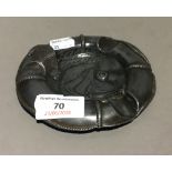 A Continental pewter life ring and fish form ashtray