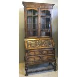 An early 20th century oak bureau bookcase