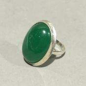 A silver and jade ring