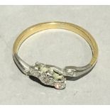 A gold and diamond crossover ring