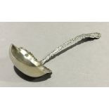 A silver ladle