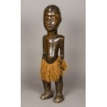 A large African tribal carved wooden male marriage or fertility ancestor figure,